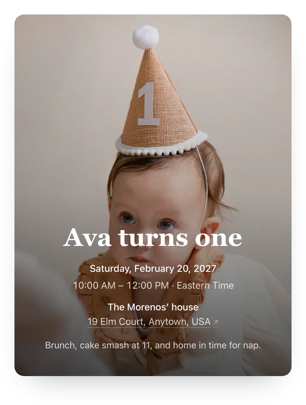First birthday invitation with the host’s own photo as the cover: a baby in a little party hat with a 1 on it behind “Ava turns one”