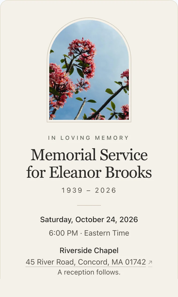 Memorial service invitation on a phone in the Ivory style: a framed photo of blossoms, "In loving memory," Memorial Service for Eleanor Brooks, 1939 – 2026, with the date, time, and chapel