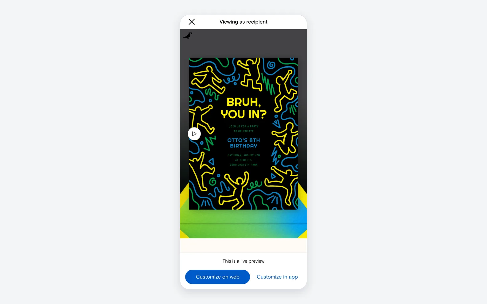 A Paperless Post kids' birthday invitation shown on a phone in recipient preview, with the card resting on its envelope.